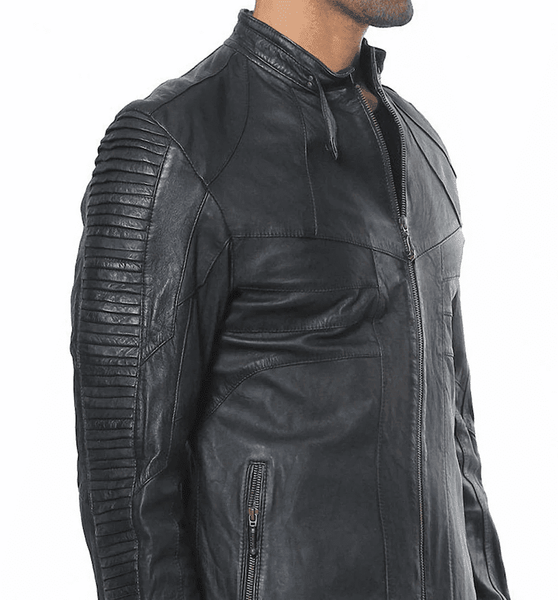 Lambskin Leather Jacket | Ribbed Black Leather Jacket A side-profile view of a man wearing a black, slim-fit leather jacket, highlighting the detailed horizontal ribbed quilting along the sleeve and the silver zipper on a side waist pocket.