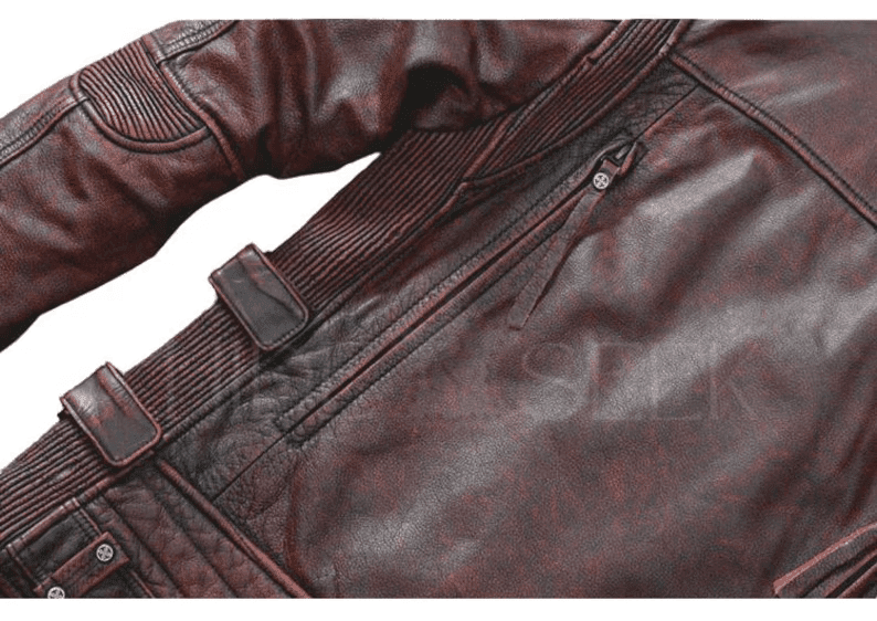 A close-up shot focusing on the back-side detailing, showcasing the vertical zipper vent, ribbed texture, and an adjustable side buckle strap with a weathered finish.