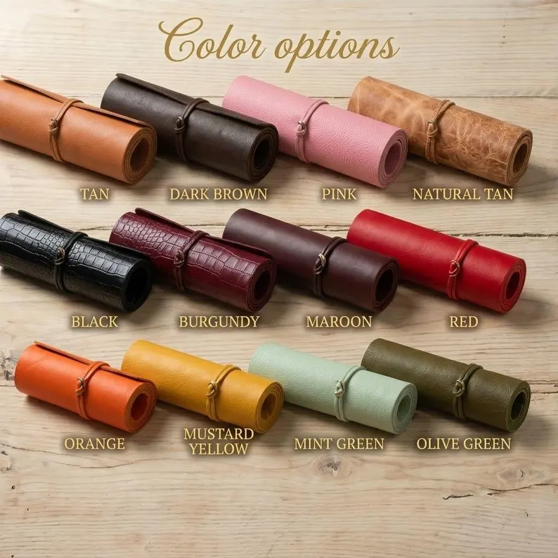 Luxury Pet Carry Bag | Structured Leather Pet Carrier A display of twelve premium leather color options for the luxury pet carry bag, including Tan, Black, Burgundy, Mint Green, and Mustard Yellow, shown as rolled material samples on a wooden surface.