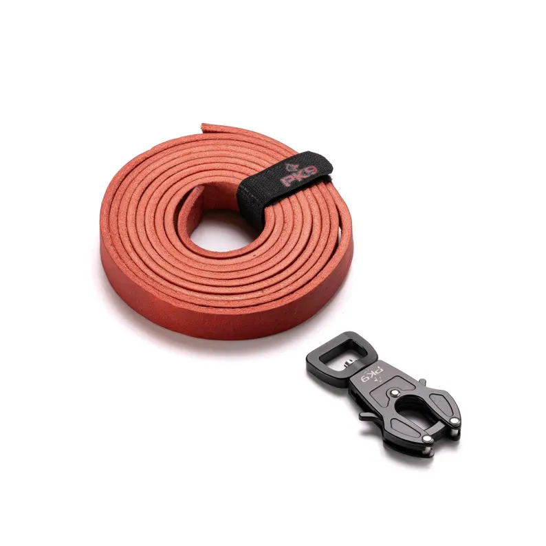 Leather Dog Leash | Aussie Red Hide with Quick-Release Frog Clip product display showing a tightly coiled red leather dog leash next to a detached black tactical swivel frog clip on a white studio background.