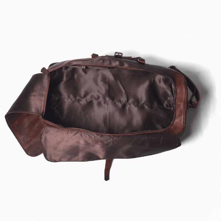 Full Grain Leather Duffel Bag | Genuine Leather Travel Bag A top-down view of the empty leather duffel bag, showcasing the spacious interior lined with a smooth, dark brown fabric and an internal zippered pocket.